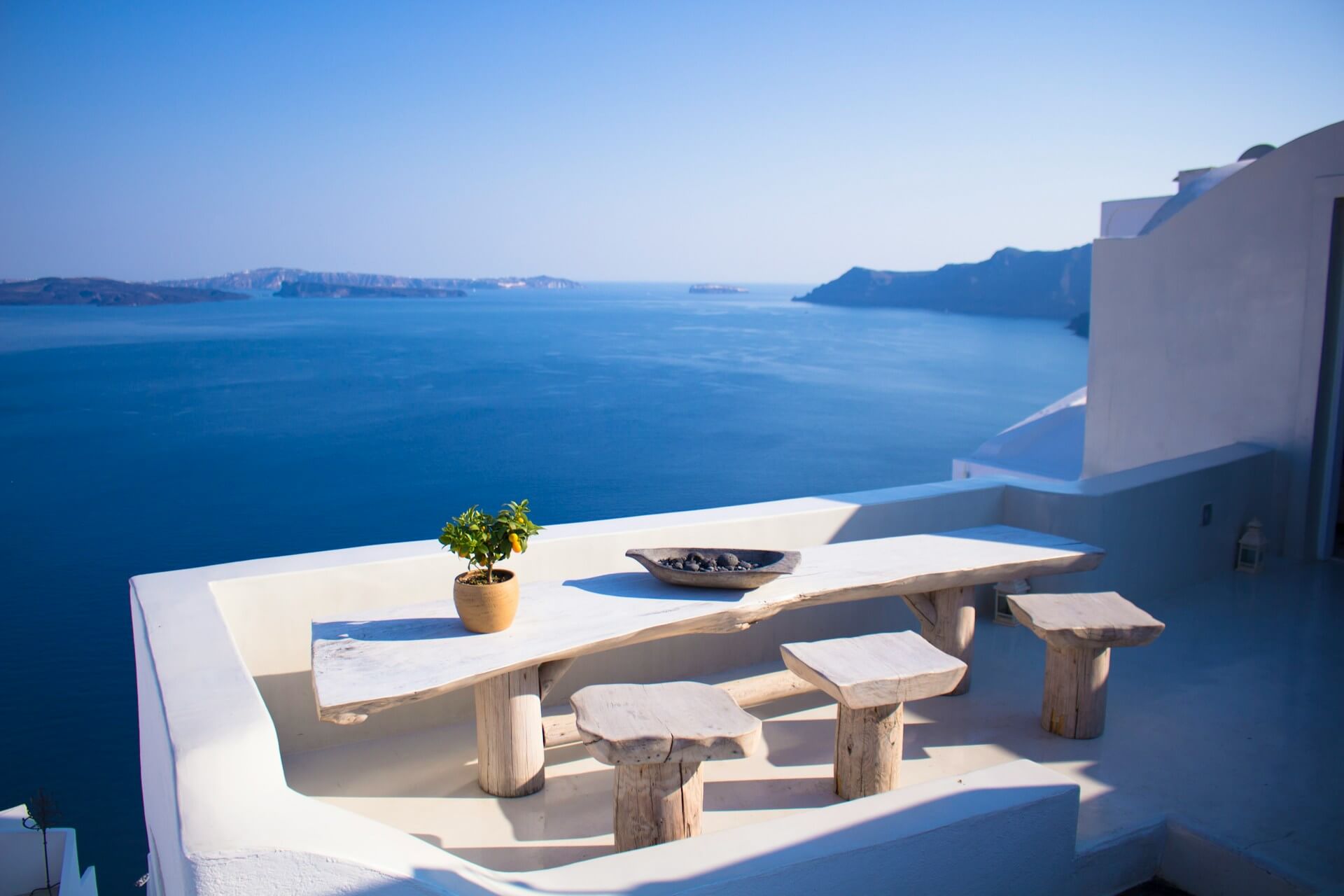 Greek table and view from Santorini to sea
